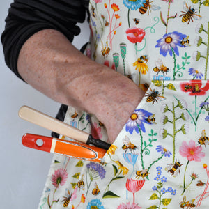 Close up of pocket on retro bee apron.