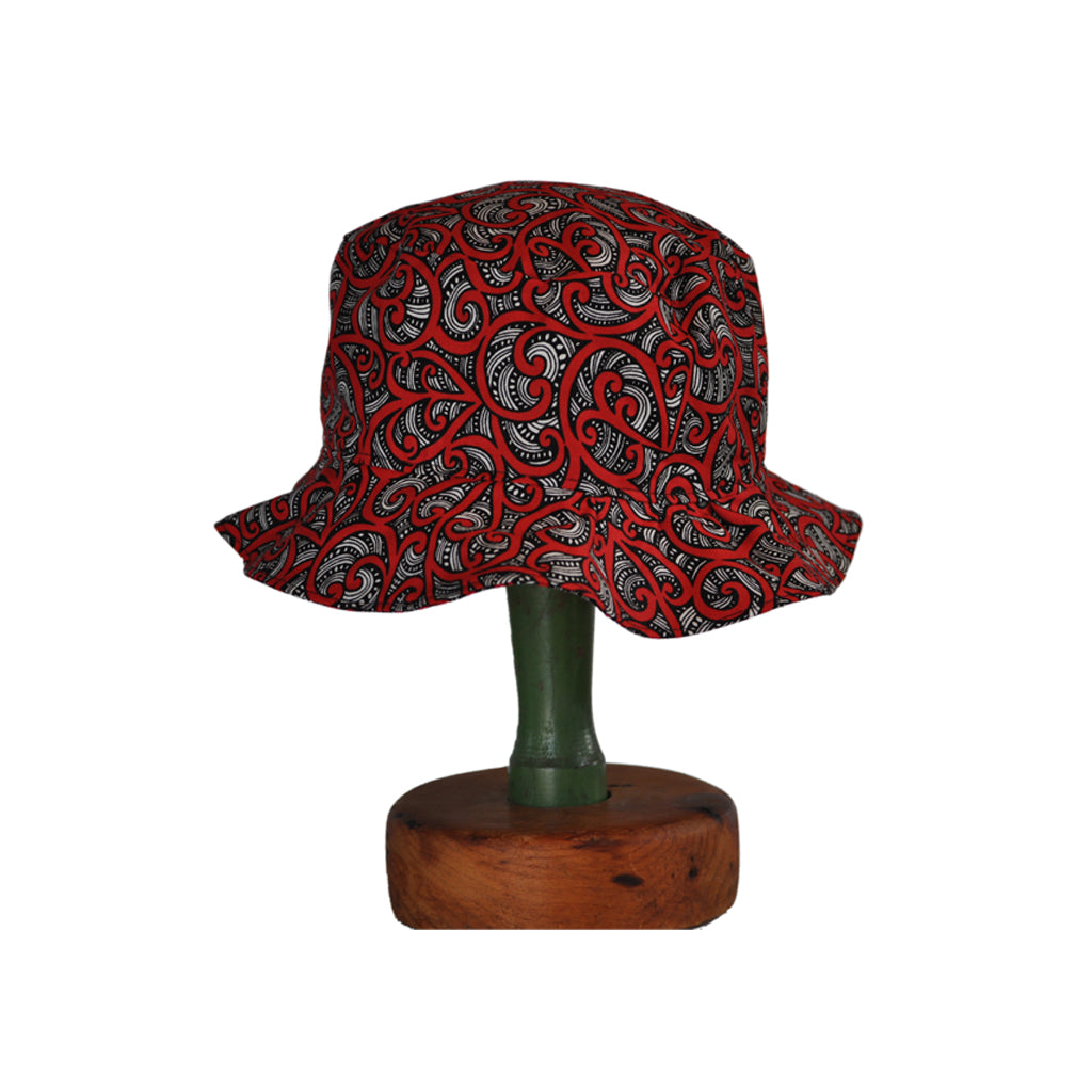 Hand sewn fabric hat with Maori Koru pattern.