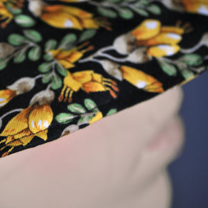 Close up of kowhai pattern bucket hat