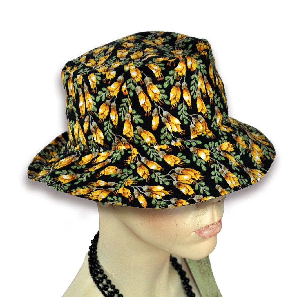 Kowhai pattern on bucket hat worn by mannequin.