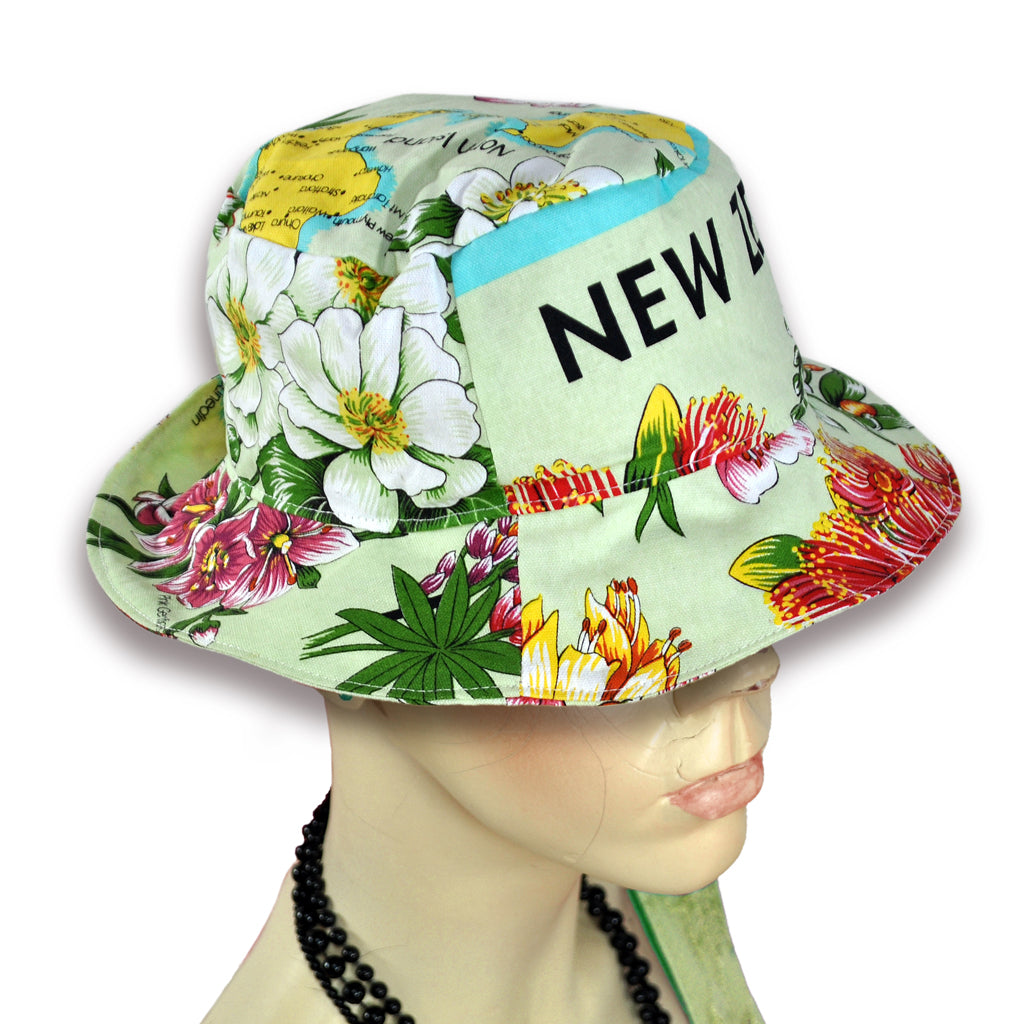 NZ map pattern on bucket hat worn by mannequin.