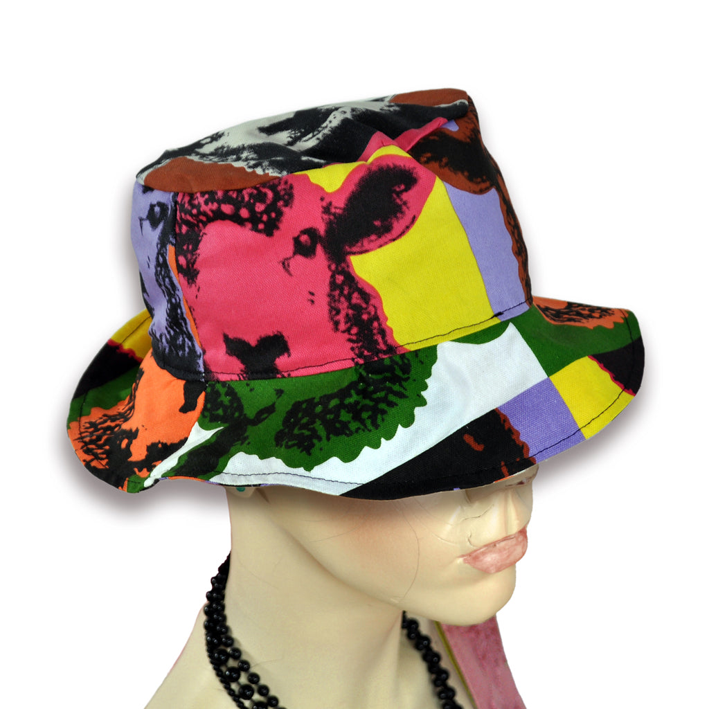 Pop art sheep pattern on bucket hat worn by mannequin.