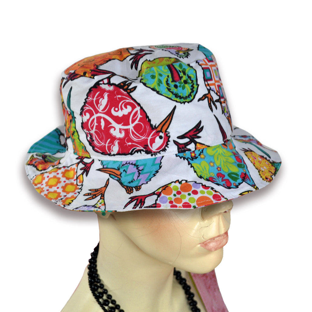 Fun quirky kiwi pattern on hand sewn bucket hat worn by mannequin.